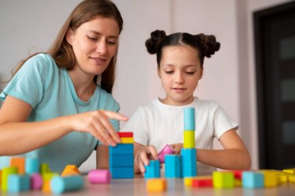 young-female-psychologist-helping-girl-speech-therapy-min